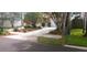 Well-maintained home with fresh landscaping, healthy lawn, and inviting driveway at 409 S Arrawana Ave, Tampa, FL 33609