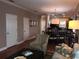 A living room view showcasing decor and layout, seamlessly connected to the dining and kitchen at 409 S Arrawana Ave, Tampa, FL 33609