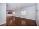 A bright living room boasts pristine hardwood floors, crown molding, and recessed lighting at 409 S Arrawana Ave, Tampa, FL 33609