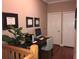 Comfortable home office with desk, chair, certificates and plant on second floor near hallway at 409 S Arrawana Ave, Tampa, FL 33609