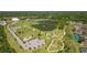 Aerial view of community featuring lakes, walking paths, tennis and pool at 4160 Pinelake Ln # 201, Tampa, FL 33618