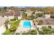 Aerial view of community pool, lake and surrounding community at 4160 Pinelake Ln # 201, Tampa, FL 33618