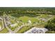Aerial view of community featuring lakes, playgrounds, and surrounding community features at 4160 Pinelake Ln # 201, Tampa, FL 33618