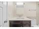 Bright bathroom with a modern vanity, white countertop, and sleek fixtures at 4160 Pinelake Ln # 201, Tampa, FL 33618