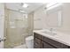 Updated bathroom featuring a glass-enclosed shower and modern vanity at 4160 Pinelake Ln # 201, Tampa, FL 33618