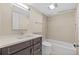Bathroom featuring a vanity with dark wood cabinets, white countertop, and a shower-tub combo at 4160 Pinelake Ln # 201, Tampa, FL 33618