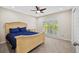 Bedroom with a large bed, window with shutters, and neutral tones at 4160 Pinelake Ln # 201, Tampa, FL 33618