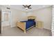 Bedroom featuring a bed, neutral walls, and adjacent bathroom at 4160 Pinelake Ln # 201, Tampa, FL 33618