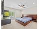 Bedroom with a ceiling fan, aquarium, and a bright window at 4160 Pinelake Ln # 201, Tampa, FL 33618