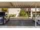 Carport showcasing covered parking spaces and building exterior at 4160 Pinelake Ln # 201, Tampa, FL 33618
