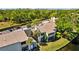 An exterior view of the home showing landscaping and parking at 4160 Pinelake Ln # 201, Tampa, FL 33618