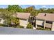 The building's exterior showcases well maintained landscaping at 4160 Pinelake Ln # 201, Tampa, FL 33618