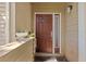 Inviting condo front door featuring a side window, unit number 201, and a plant at 4160 Pinelake Ln # 201, Tampa, FL 33618