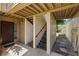 Exterior entrance with open staircase, tan stucco walls, and walkway to a waterway at 4160 Pinelake Ln # 201, Tampa, FL 33618