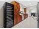 Spacious kitchen has stainless steel appliances, tile floors, and warm wood cabinetry at 4160 Pinelake Ln # 201, Tampa, FL 33618
