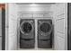 Laundry closet has modern washer and dryer units at 4160 Pinelake Ln # 201, Tampa, FL 33618