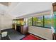 Bright room shows two large aquariums with views of the lake and backyard at 4160 Pinelake Ln # 201, Tampa, FL 33618