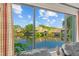 Comfortable living room showcasing a picturesque lake view through large windows at 4160 Pinelake Ln # 201, Tampa, FL 33618