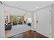 Bright living room with neutral carpet, fireplace, vaulted ceiling, and large windows overlooking a water view at 4160 Pinelake Ln # 201, Tampa, FL 33618