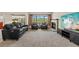 Living room featuring a modern fireplace, a TV, and a comfortable seating arrangement at 4160 Pinelake Ln # 201, Tampa, FL 33618