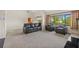 Spacious living room with a sleek fireplace, ample natural light, and stylish furnishings at 4160 Pinelake Ln # 201, Tampa, FL 33618