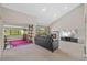 Open-concept living room with a brick fireplace, water view, and plush seating for relaxation at 4160 Pinelake Ln # 201, Tampa, FL 33618