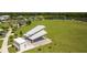 Aerial view of picnic pavilion and expansive green space near lake and playground at 4160 Pinelake Ln # 201, Tampa, FL 33618