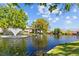 Scenic pond view with a fountain and manicured landscaping, creating a serene ambiance for lakeside condos at 4160 Pinelake Ln # 201, Tampa, FL 33618