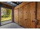 Outdoor storage unit with wooden doors and unit number at 4160 Pinelake Ln # 201, Tampa, FL 33618