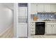 Conveniently located, a full-size stackable washer and dryer in the kitchen at 4207 W San Rafael St # E, Tampa, FL 33629