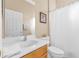 Bright bathroom featuring a vanity with white sink and a shower with white curtain at 4315 70Th E Ave, Ellenton, FL 34222