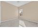 A bright bedroom featuring neutral walls, carpet flooring, and a window, offering a simple and inviting space at 4315 70Th E Ave, Ellenton, FL 34222