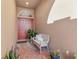 Cozy front porch featuring double doors, brick flooring, and a comfortable bench at 4315 70Th E Ave, Ellenton, FL 34222