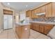 Bright kitchen with an island, stainless steel appliances, and wood cabinets at 4315 70Th E Ave, Ellenton, FL 34222