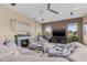 Cozy living room with a fireplace, comfortable seating, and a view of the outdoors at 4315 70Th E Ave, Ellenton, FL 34222