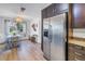 Open dining area with stainless steel refrigerator and large window with natural light at 4500 35Th N Ave, St Petersburg, FL 33713