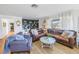 Bright living room with leather sofa and custom built-in shelving at 4500 35Th N Ave, St Petersburg, FL 33713