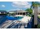 Community pool and cabana with lounge chairs for residents of the townhome community to enjoy at 5831 Leopardstown Dr, Tampa, FL 33610
