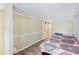 This bedroom has modern wood floors and a sliding wooden door that leads into another room at 647 Yawl Ln, Palm Harbor, FL 34683
