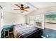 Cozy bedroom featuring a comfortable bed, soft lighting, and modern decor at 647 Yawl Ln, Palm Harbor, FL 34683