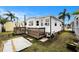Charming single Gathering home with wood deck and a well maintained lawn at 647 Yawl Ln, Palm Harbor, FL 34683