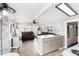 Open-concept living and kitchen area featuring modern decor and ample natural light at 647 Yawl Ln, Palm Harbor, FL 34683