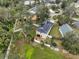 Backyard featuring solar panels, a trampoline, and a cozy patio area at 6930 Summer Harbor Ln, Riverview, FL 33578