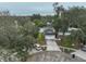 Inviting two-story home features a two-car garage, lush greenery, and a well-maintained lawn at 6930 Summer Harbor Ln, Riverview, FL 33578