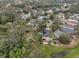 This property is surrounded by mature trees, has a spacious yard, and solar panels at 6930 Summer Harbor Ln, Riverview, FL 33578