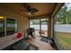 Relaxing screened back porch and fenced in patio for outdoor living at 6930 Summer Harbor Ln, Riverview, FL 33578