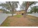 Large backyard with trees and plenty of grass, all fenced in for privacy at 6930 Summer Harbor Ln, Riverview, FL 33578