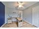 Bedroom with hardwood-style floors, bright window, and custom built-in desk at 6930 Summer Harbor Ln, Riverview, FL 33578