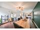 Open-concept dining area with wood floors and ample space for entertaining guests at 6930 Summer Harbor Ln, Riverview, FL 33578