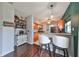 Kitchen with breakfast bar and modern stools, open to the living area at 6930 Summer Harbor Ln, Riverview, FL 33578